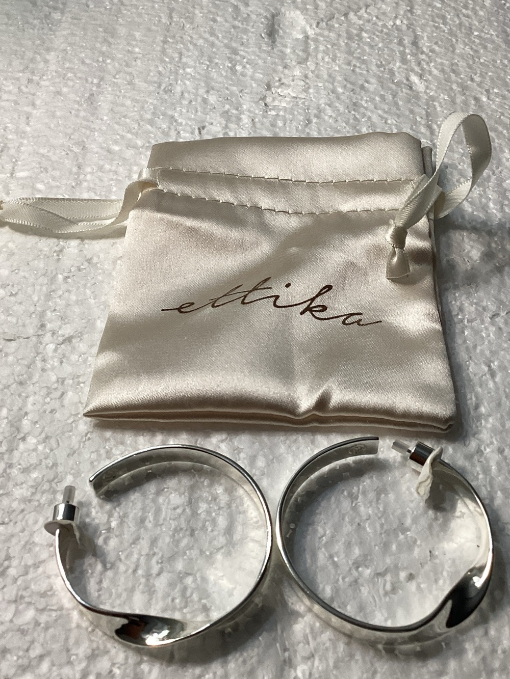 Ettika silver-plated twisted hoop earrings from Ettika